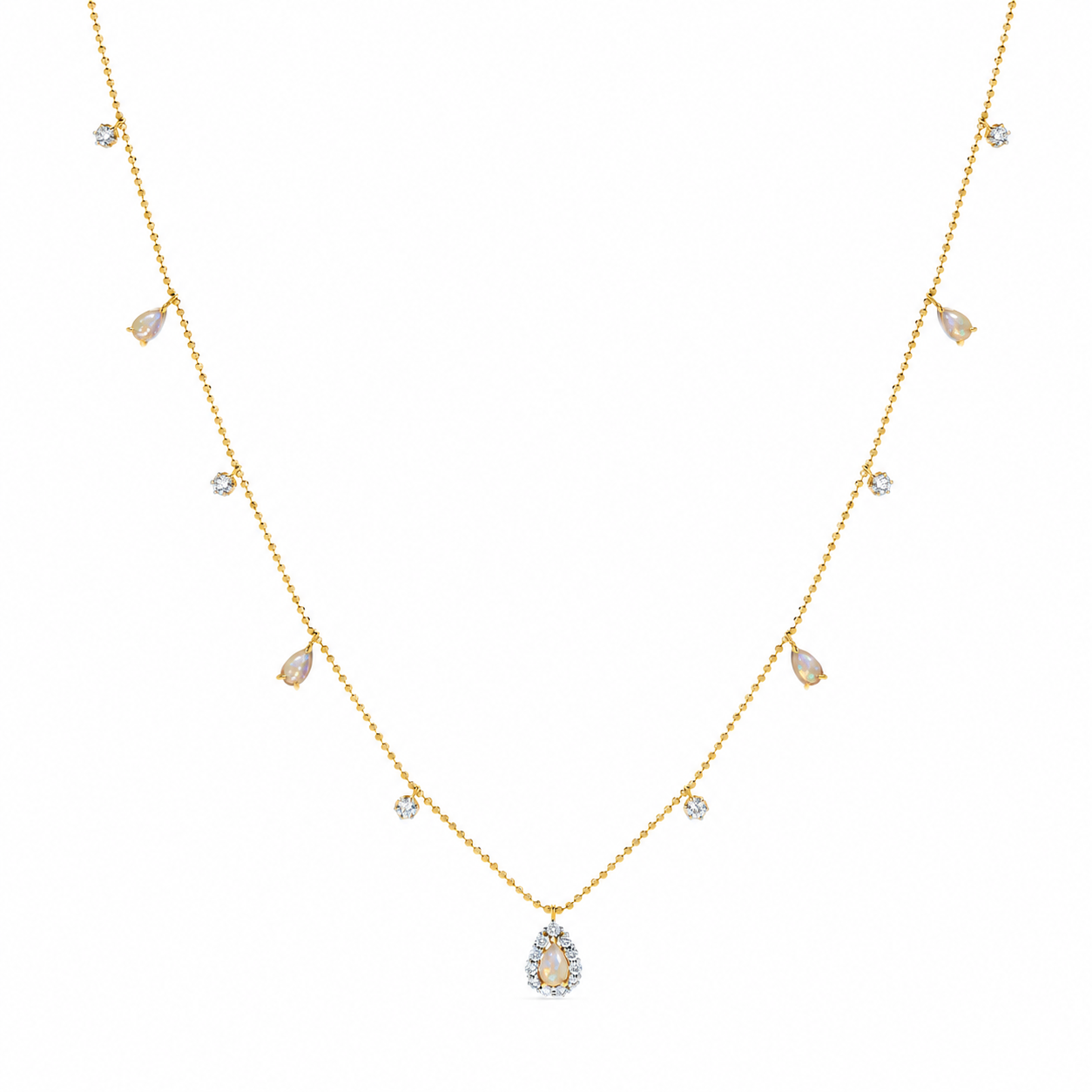 Collar con dije de lágrima de 18 quilates con piedras preciosas
