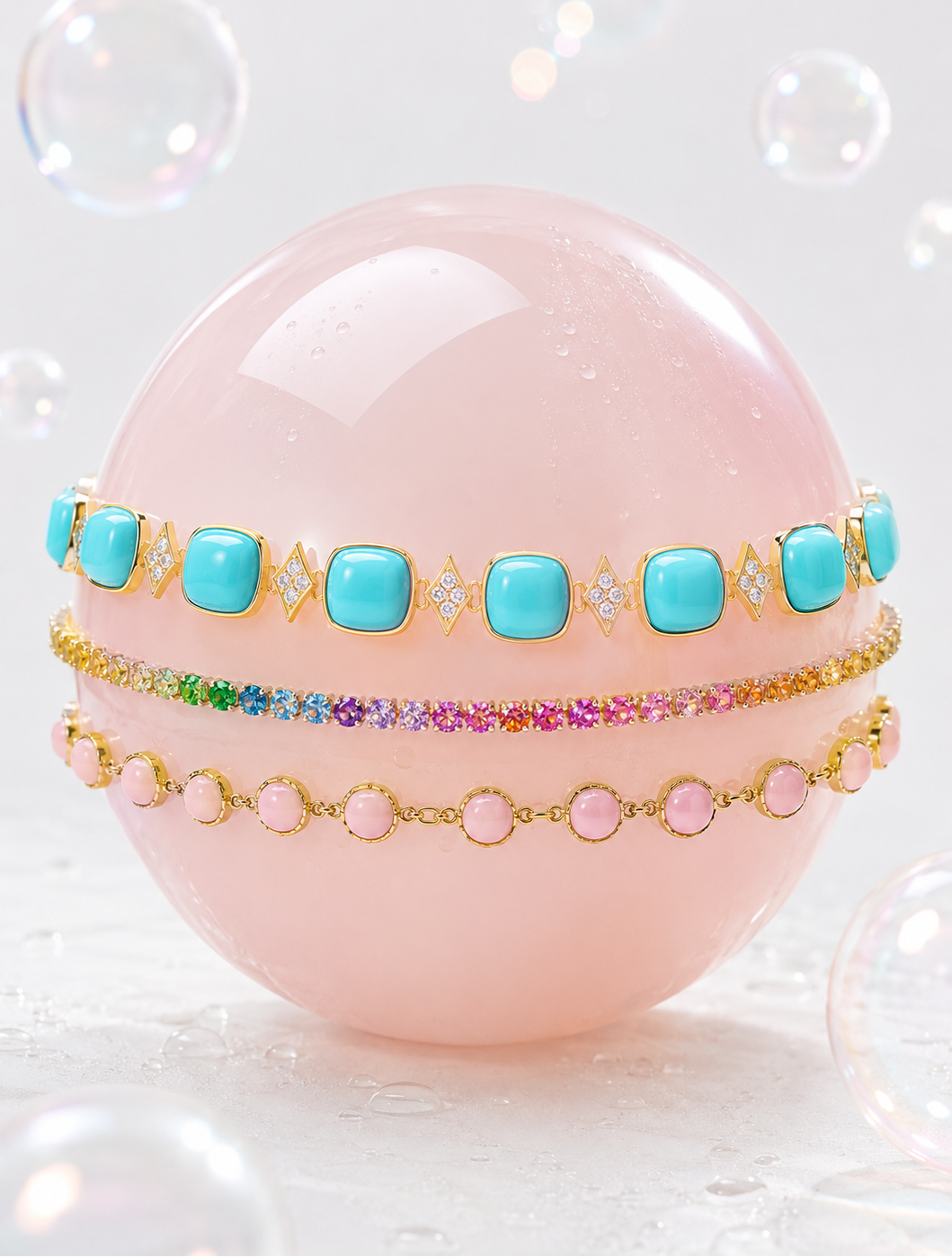 Set of colorful bracelets on a pink sphere with bubbles in the background